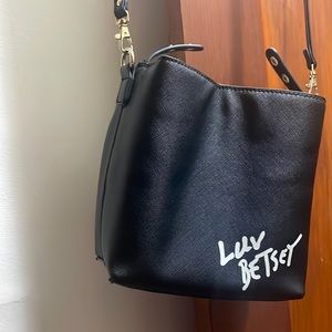 Perfect on the go all black faux leather Betsy Johnson bag.